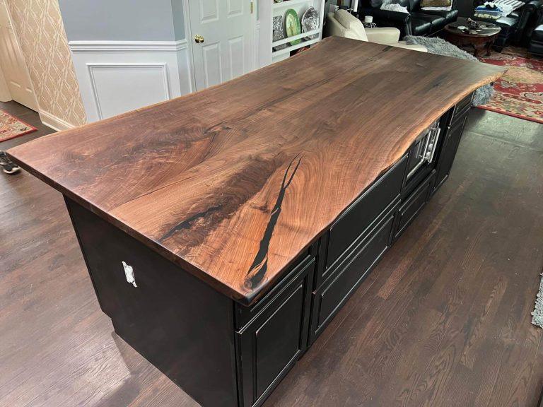 Black walnut live edge kitchen island top by Makers Woodshop