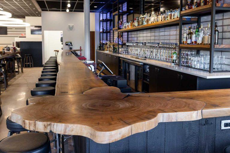 Live edge hardwood bar top at Reckless Ale Works, built by Makers Woodshop